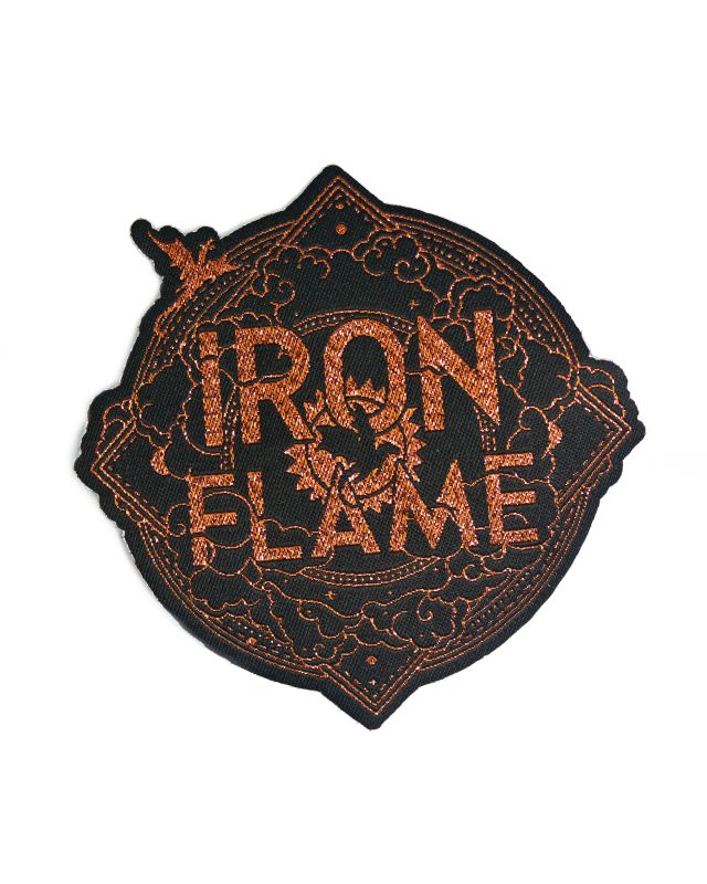 A glittery woven patch custom made with the Iron Flame logo.
