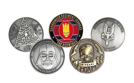 A selection of five custom coins made to commemorate military units, EDC groups and pop-culture genres.
