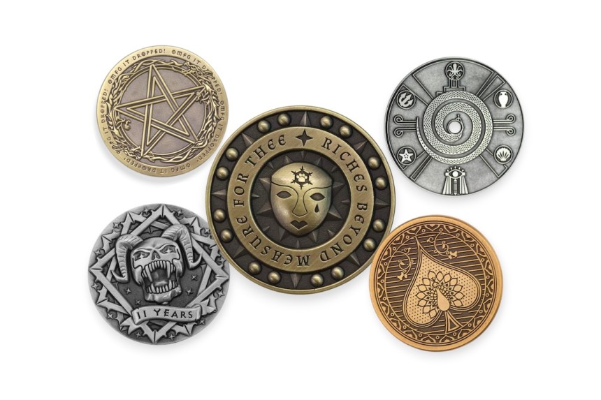 3D vs die-struck custom coins showing raised skull design and flat engraved coffee coin for comparison of depth and detail.