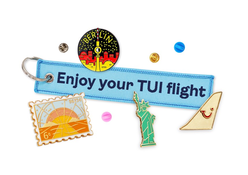 A collection of travel-related custom merch to answer the question