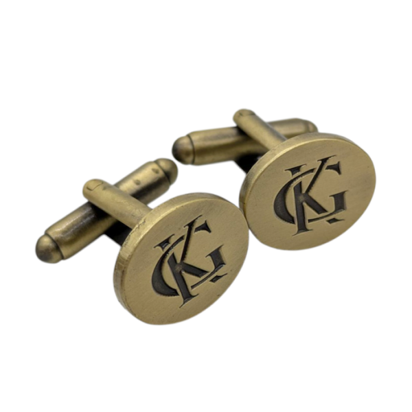 Antique Gold Plated custom cufflinks with the initials KG intertwined.