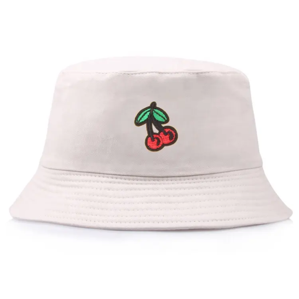 A white bucket hat with red cherries embroidered on the front.