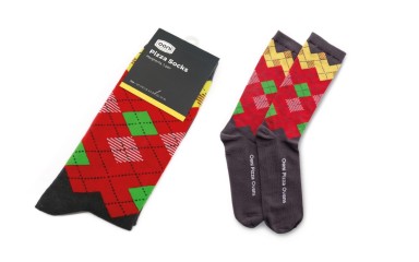 Custom pizza socks made with us by Ooni. The argyle pattern has been made to look like pizza slices.