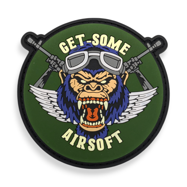A PVC patch featuring a screaming vicious monkey wearing flight goggles. The patch reads