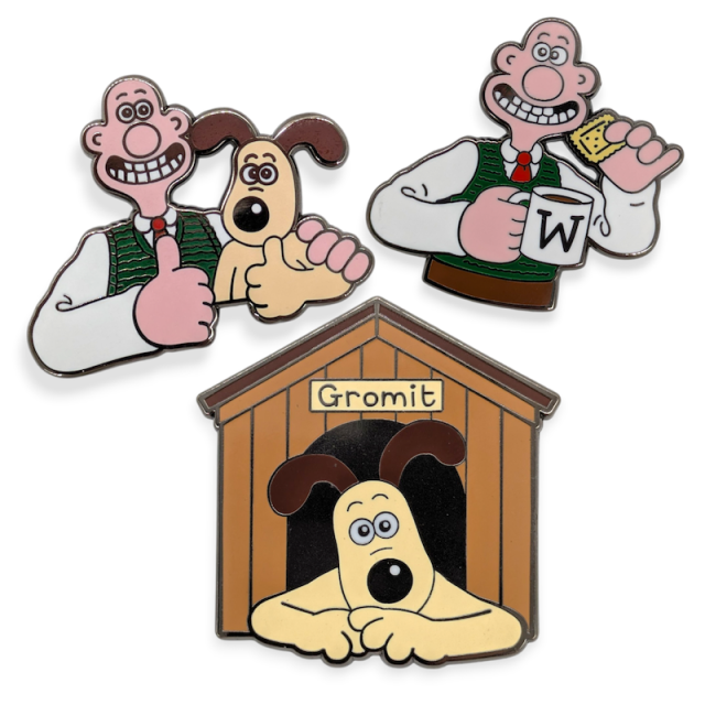 Custom fridge magnets showing Wallace giving a thumbs up with Gromit, Wallace holding a W mug and biscuit, and Gromit in a labelled doghouse, bright enamel finish.