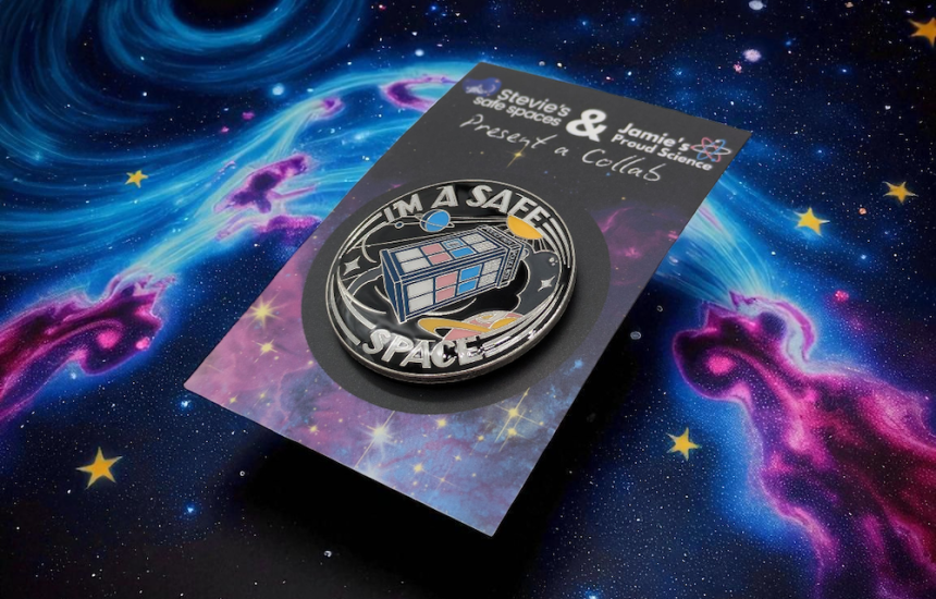 circular pin badge with a TARDIS in the middle made up of the trans pride flag colours. Around the TARDIS reads the words 