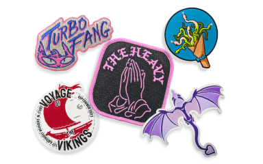 A collection of five custom patches showcasing the difference between overlocked and heat-cut edges.