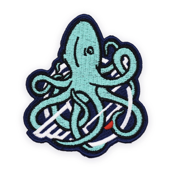 Embroidered patch depicting a stylised squid with flowing tentacles in teal and navy thread, stitched with clean outlines, designed as a custom embroidered patch for marine, nautical or creative embroidered patches.