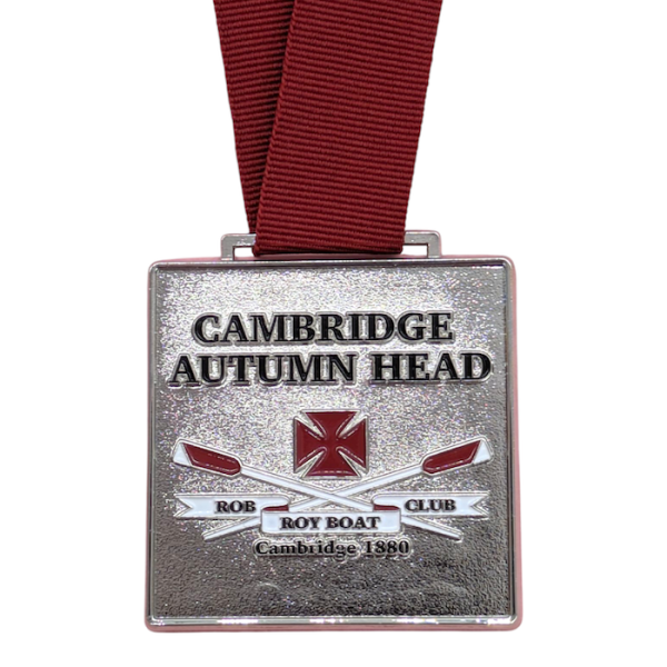A square silver rowing medal with a burgundy ribbon.