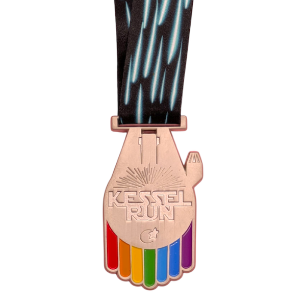 A custom enamel medal in the shape of the Millennium Falcon from Star Wars. The Medal reads