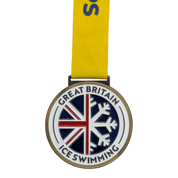 A circular enamel medal with the a cross-section image of the Union Flag and a Snowflake in the middle. The words