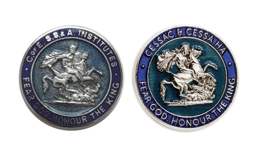 A 133 year old pin badge sat next to it's modern day recreation. The circular badge has a blue outer ring with a 3D model in silver of St George on his horse in the middle.