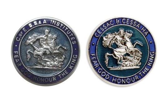A 133 year old pin badge sat next to it's modern day recreation. The circular badge has a blue outer ring with a 3D model in silver of St George on his horse in the middle.