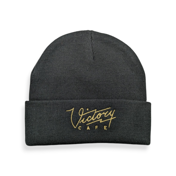 A grey knitted beanie hat with a blue embroidered 'M' logo.