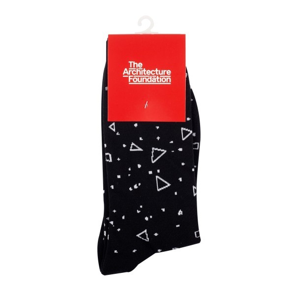 Branded custom socks in black with white shapes, neatly packaged for The Architecture Foundation, highlighting high quality custom knitted sock designs.