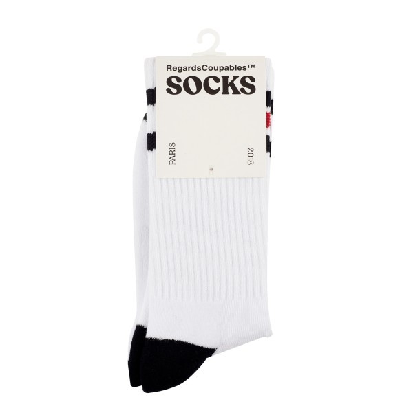 Folded custom sports socks in white with black detail, presented with branded packaging for professional custom sock merchandise.