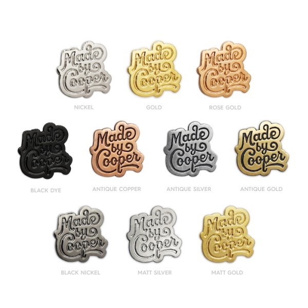 Ten pin badges of the Made by Cooper logo showcasing the different types of platings.