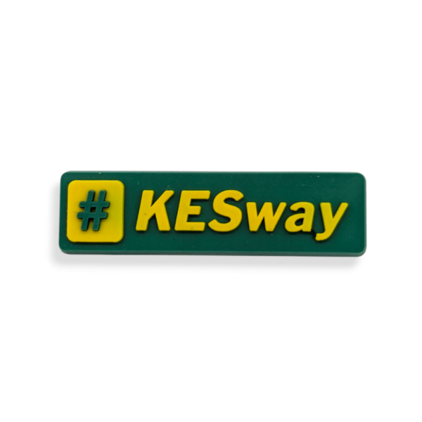A green rectangular PVC badge with