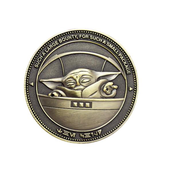 An antiqued gold plated custom Star Wars challenge coin featuring Grogu from the TV show The Mandalorian.