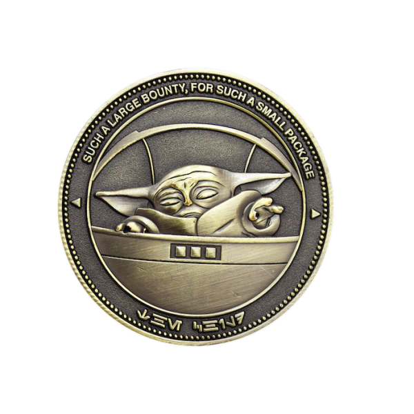 An antiqued gold plated custom Star Wars challenge coin featuring Grogu from the TV show The Mandalorian.