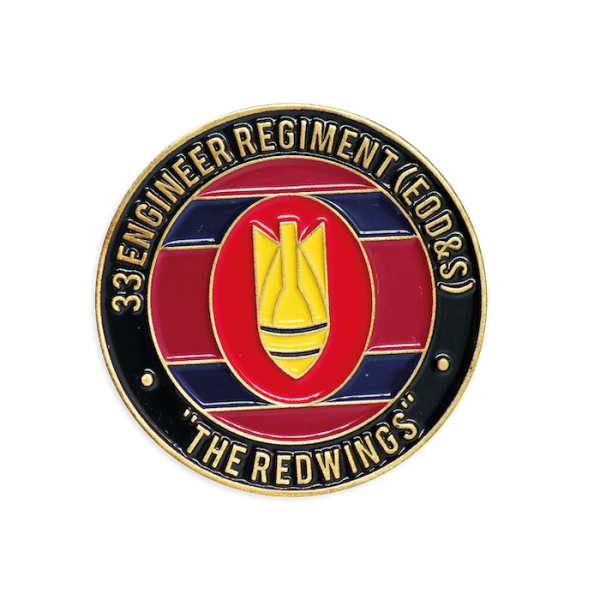 A colored enamel black and red challenge coin celebrating a firefighter unit.