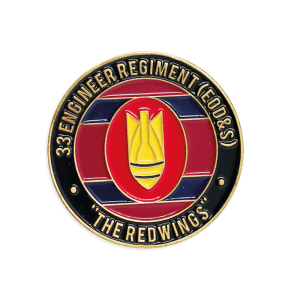 A colored enamel black and red challenge coin celebrating a firefighter unit.
