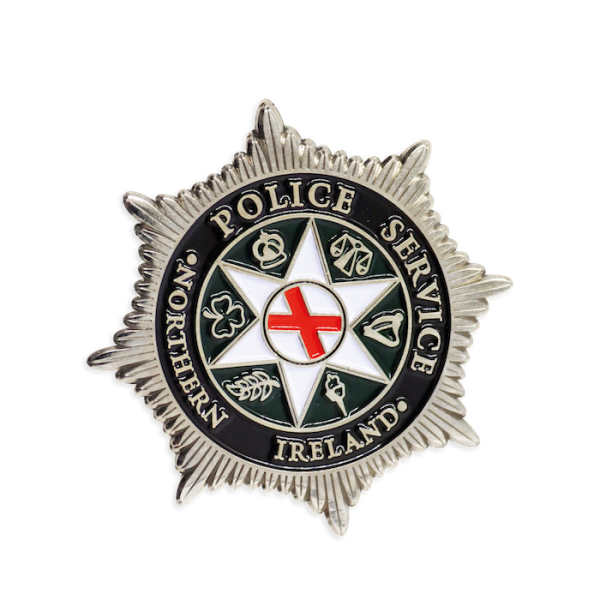 A star-shaped custom police challenge coin that features the insignia for the Northern Island Police Service.