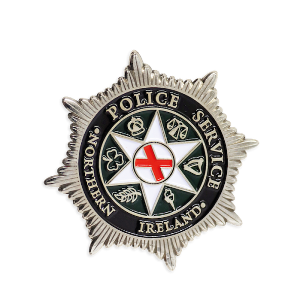 A star-shaped custom police challenge coin that features the insignia for the Northern Island Police Service.
