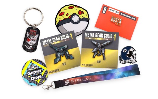 Video game pins and gaming merch including enamel pins, keyrings, lanyards and socks displayed together from some of the biggest names in the industry like Konami, Intel, Pokemon, Nintendo, and Bossa Games.