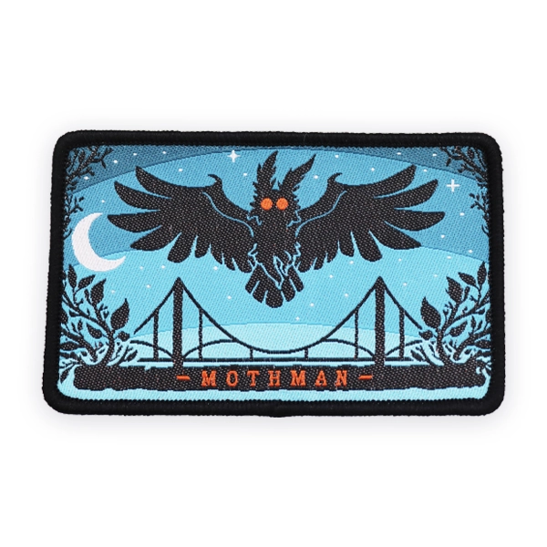 Rectangular woven patch showing Mothman flying above a bridge at night with moon and stars, designed as a detailed custom woven patch for folklore, horror or collectible woven patches.